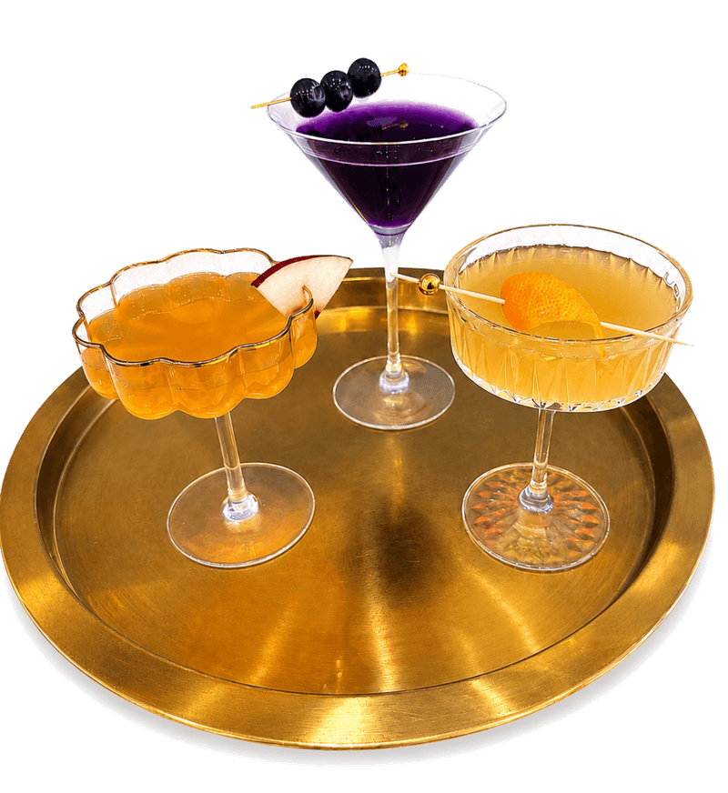 Passion de Maison, Violette Orchid, and a Maison coupe on a gold tray
